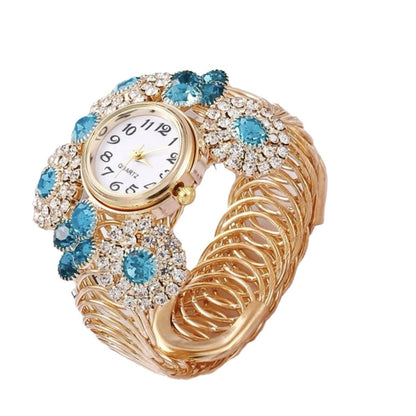 Reloj de cuarzo de lujo elegante y asequible con incrustaciones de diamantes de imitación y estrellas para mujer