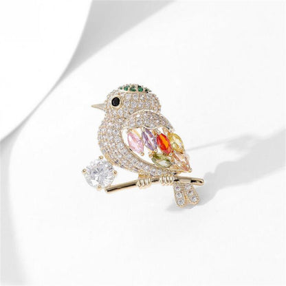 Broche de pájaro urraca con diamantes