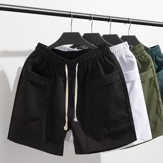 Pantalons décontractés d'été Nouveaux shorts de marque tendance à la mode pour jeunes hommes Sports amples Patchwork