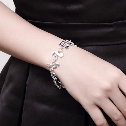 Pulsera con notas musicales nuevas, exquisita y plateada con adorno creativo popular