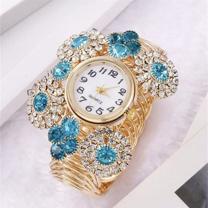 Reloj de cuarzo de lujo elegante y asequible con incrustaciones de diamantes de imitación y estrellas para mujer